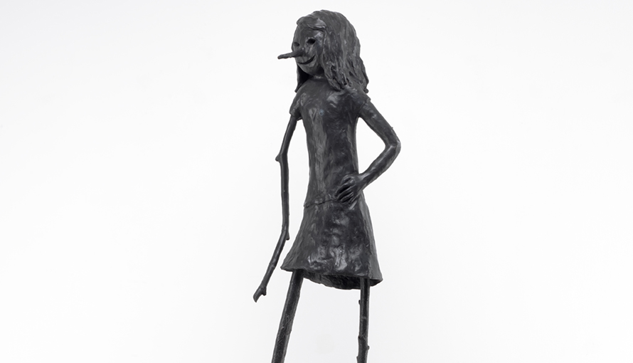 Bronze sculpture with black patination of a female creature.