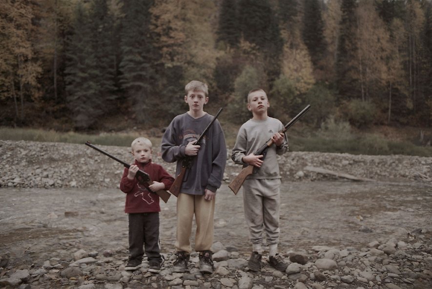 photo of boys holding rifels